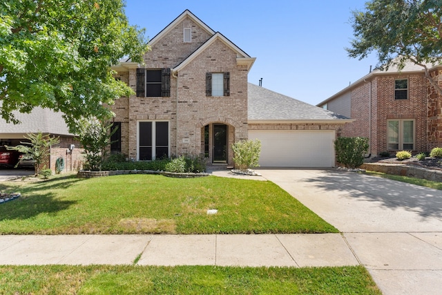 front facade featuring a front lawn and a garage