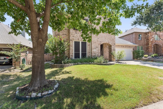 view of front facade with a front lawn and a garage