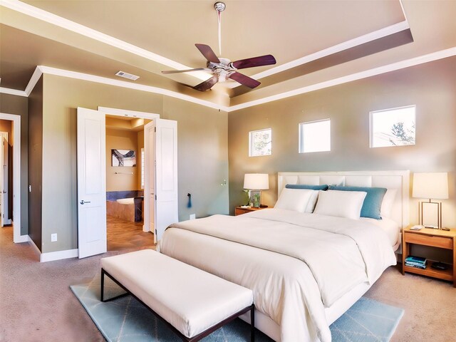 bedroom featuring ceiling fan, a raised ceiling, carpet floors, and crown molding