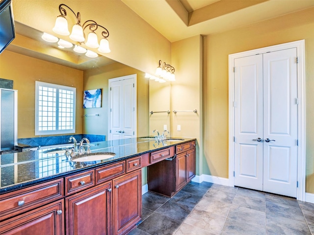 bathroom featuring vanity and a tray ceiling