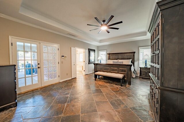 tiled bedroom with ceiling fan, a raised ceiling, french doors, access to exterior, and crown molding