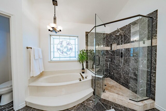 bathroom featuring a notable chandelier, toilet, shower with separate bathtub, and tile patterned floors