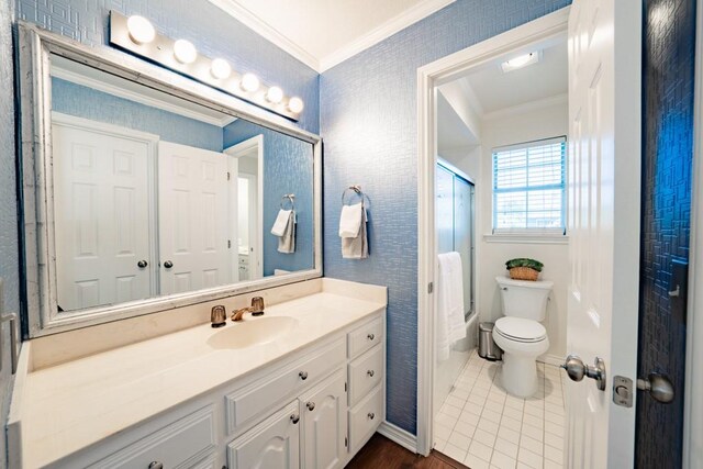 full bathroom featuring toilet, shower with separate bathtub, vanity, and ornamental molding