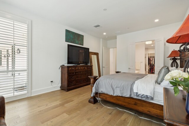 5270 Town And Country Blvd Unit 113, Frisco, TX 75034 - bedroom with recessed lighting, baseboards, visible vents, and light wood finished floors