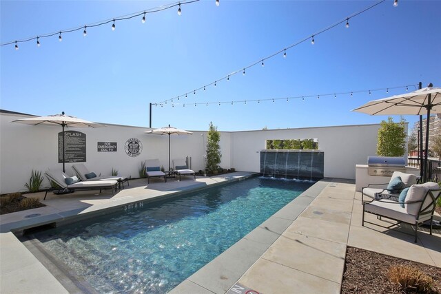 5270 Town And Country Blvd Unit 113, Frisco, TX 75034 - view of swimming pool featuring a fenced in pool, a patio area, and a grill