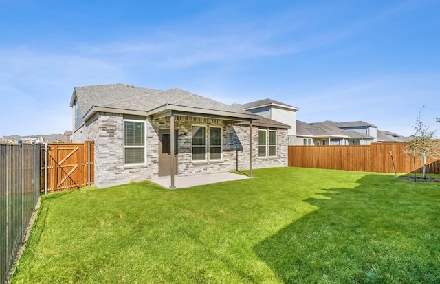 back of property with a patio and a lawn