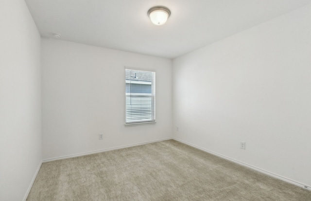 empty room with light colored carpet