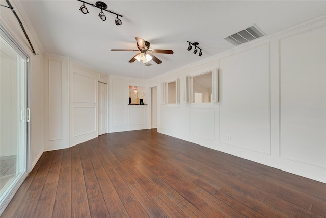 spare room with ceiling fan, rail lighting, and dark hardwood / wood-style flooring