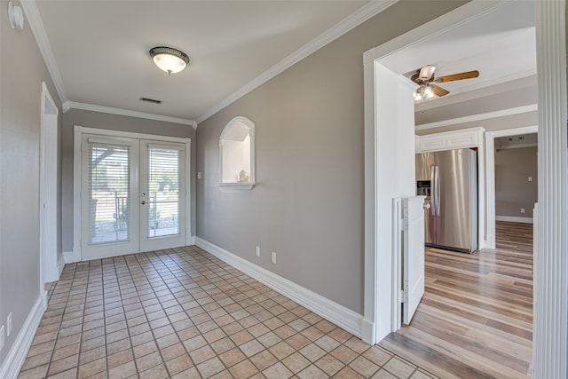 entryway with light wood-type flooring, french doors, ceiling fan, and ornamental molding