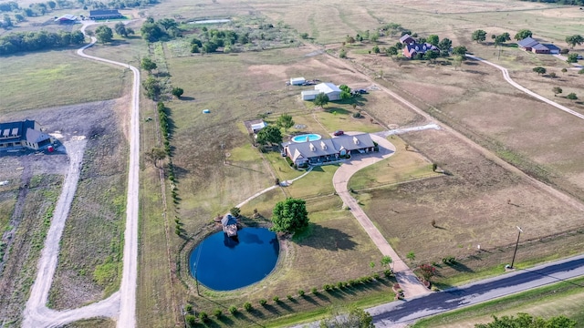 aerial view with a rural view and a water view