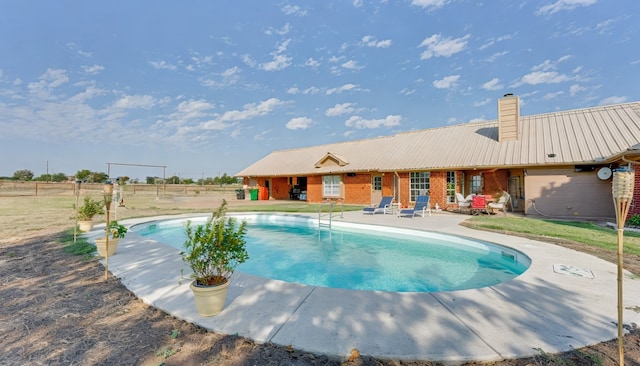 view of pool featuring a patio