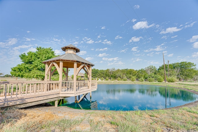 dock area with a gazebo and a water view