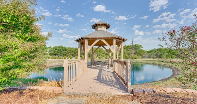 view of dock featuring a water view and a gazebo