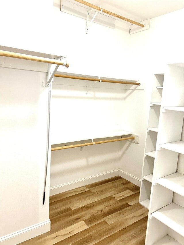 bedroom with wood-type flooring