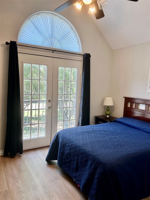 bedroom with ceiling fan, access to exterior, light wood-type flooring, and lofted ceiling