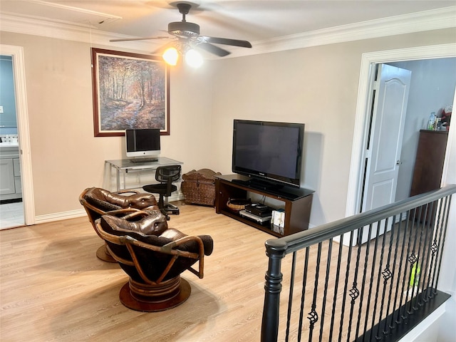 living room featuring light hardwood / wood-style flooring and crown molding