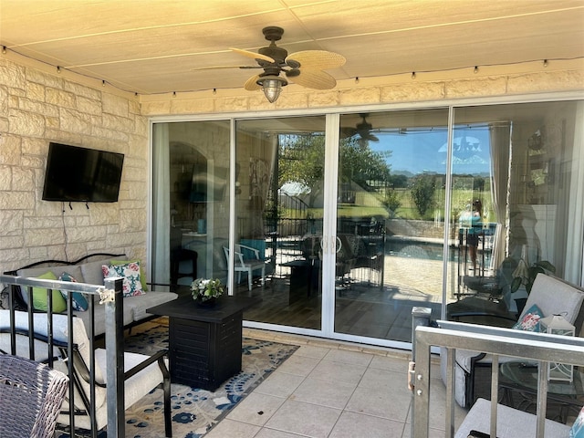 view of patio / terrace featuring ceiling fan