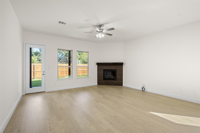 unfurnished living room featuring light hardwood / wood-style floors and ceiling fan