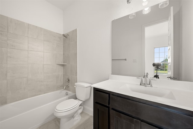 full bathroom with toilet, tiled shower / bath combo, and vanity