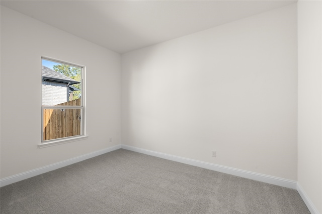 unfurnished room featuring carpet