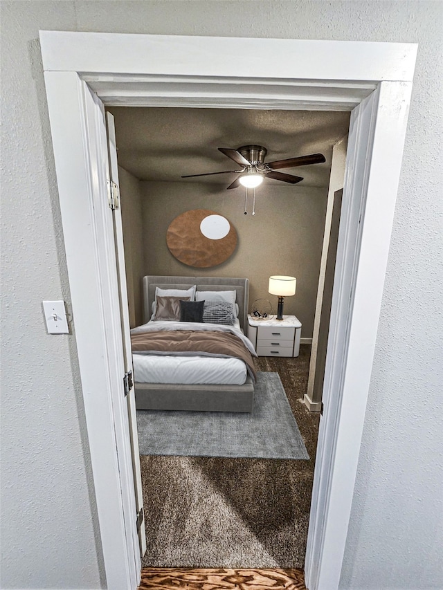 carpeted bedroom with ceiling fan