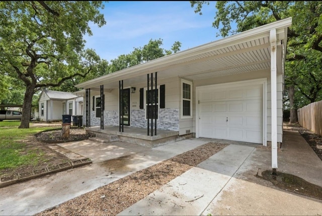 ranch-style home featuring a garage and a porch