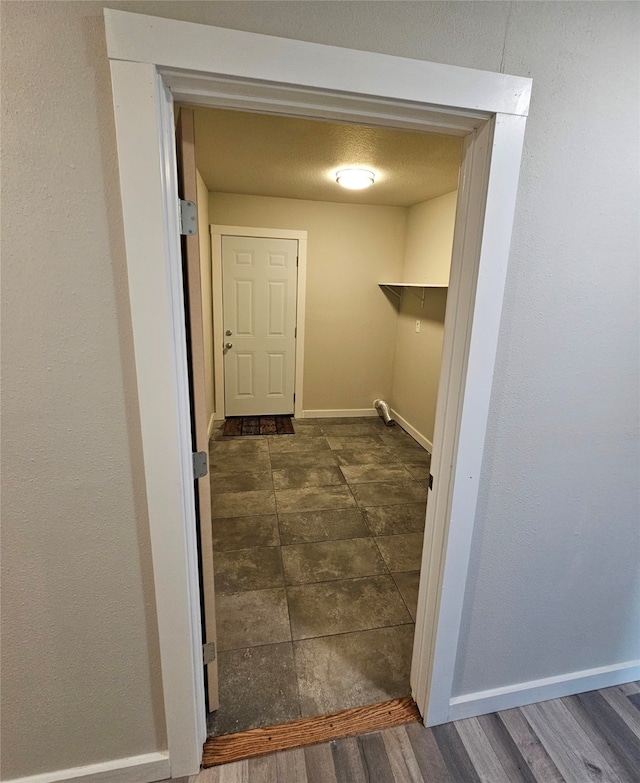 interior space with dark tile patterned flooring