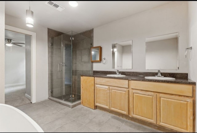 bathroom with ceiling fan, independent shower and bath, vanity, and tile patterned floors