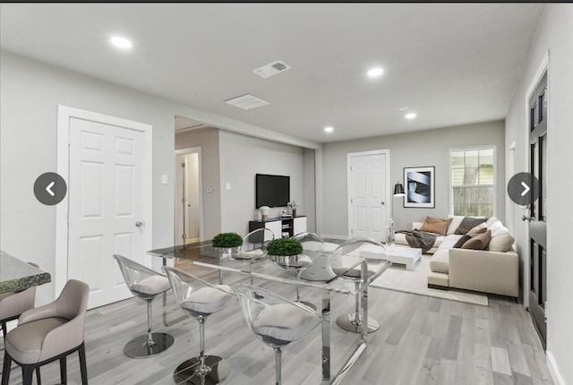 dining room with light wood-type flooring