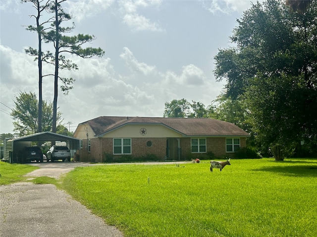 ranch-style home featuring a front yard and a carport