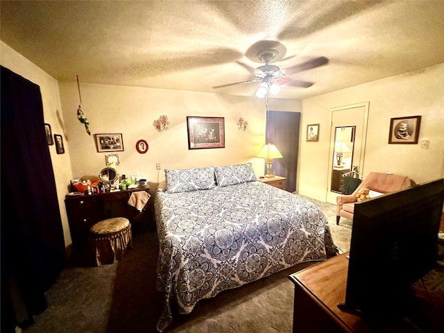 bedroom featuring ceiling fan, carpet flooring, and a textured ceiling