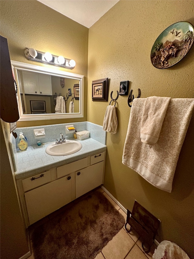 bathroom featuring tile patterned floors and vanity