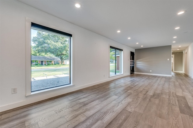 unfurnished living room featuring light hardwood / wood-style flooring