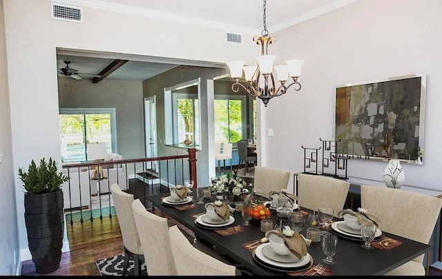 dining area featuring crown molding, ceiling fan with notable chandelier, and wood-type flooring