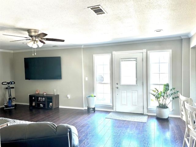 living room featuring a textured ceiling, ceiling fan, crown molding, and dark hardwood / wood-style floors