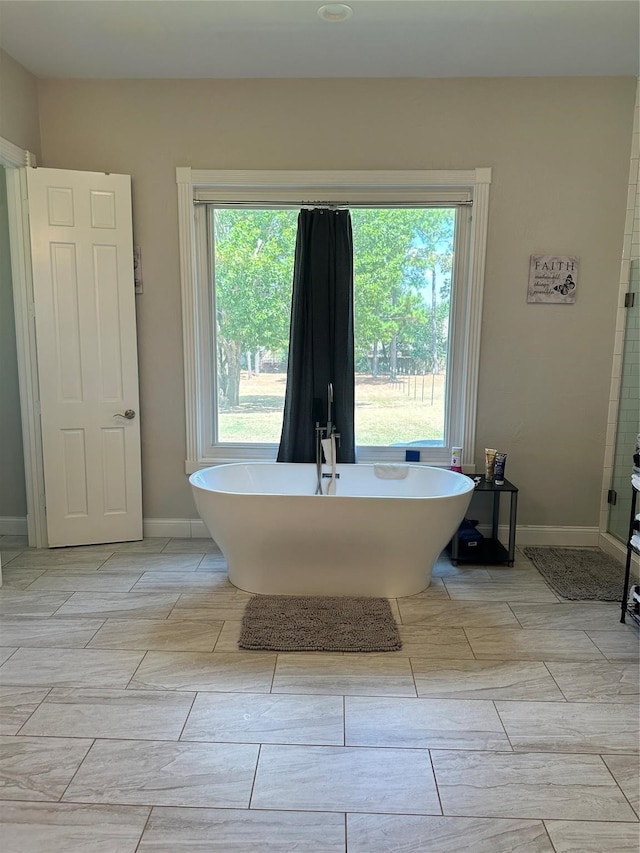 bathroom featuring a bathing tub and tile patterned floors