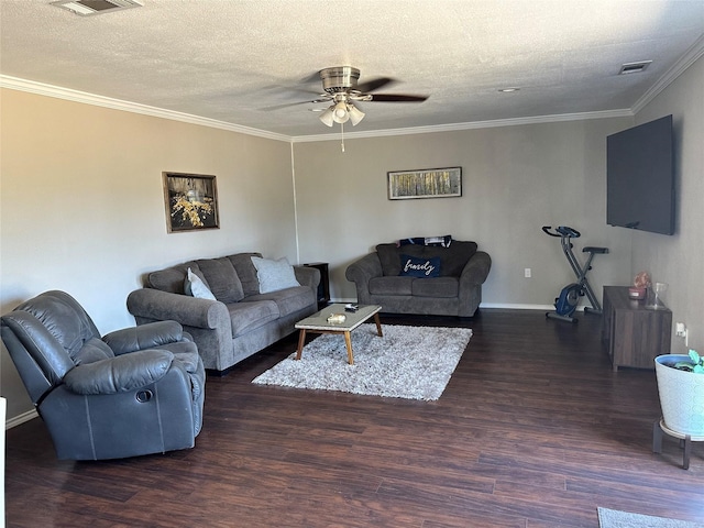 living room featuring hardwood / wood-style flooring, ceiling fan, a textured ceiling, and ornamental molding