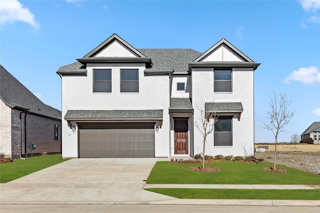 view of front facade featuring a garage and a front yard