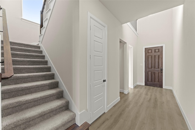 stairway featuring hardwood / wood-style floors