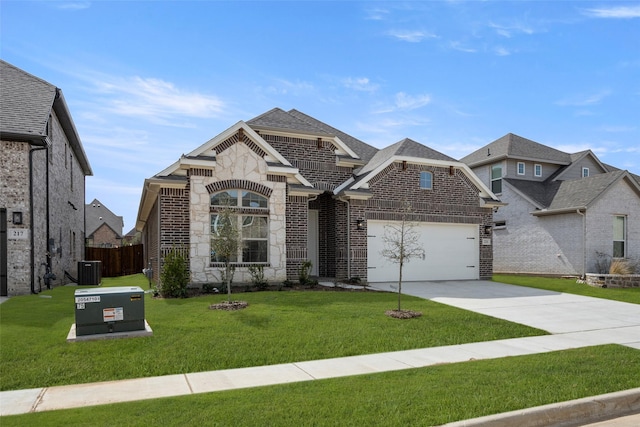 french country inspired facade with a front lawn, brick siding, an attached garage, and driveway