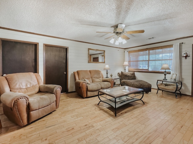 living room featuring beamed ceiling, a textured ceiling, ceiling fan, and dark hardwood / wood-style floors