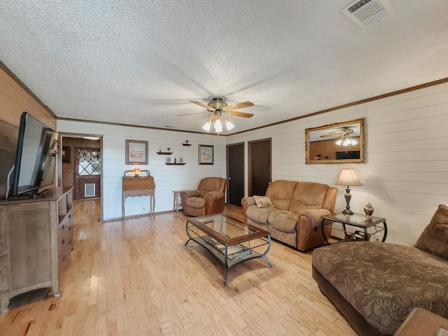 interior space featuring dark wood-type flooring, a textured ceiling, a healthy amount of sunlight, and beam ceiling