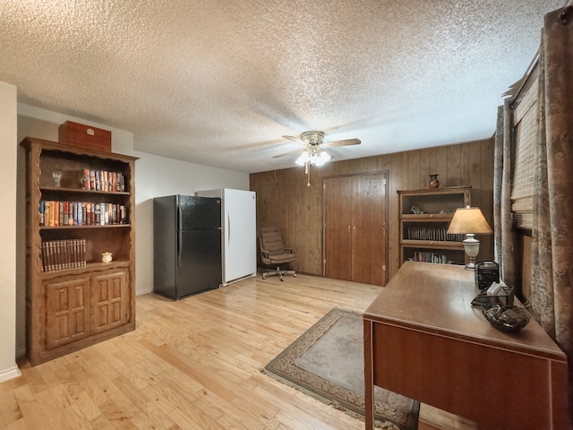 exercise area with ceiling fan and brick wall