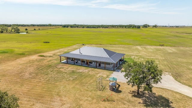 birds eye view of property with a rural view