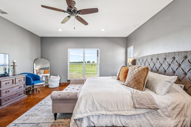 bedroom featuring dark wood-type flooring and ceiling fan