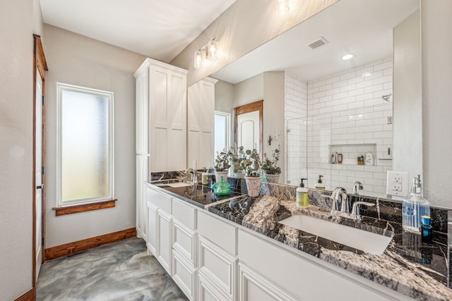 bathroom with vanity and a wealth of natural light