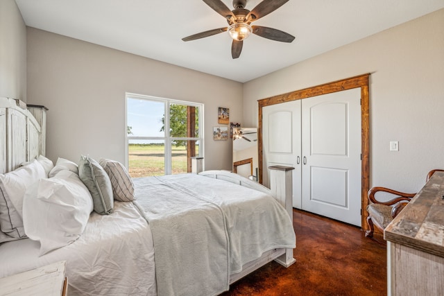 bedroom featuring dark carpet, a closet, and ceiling fan