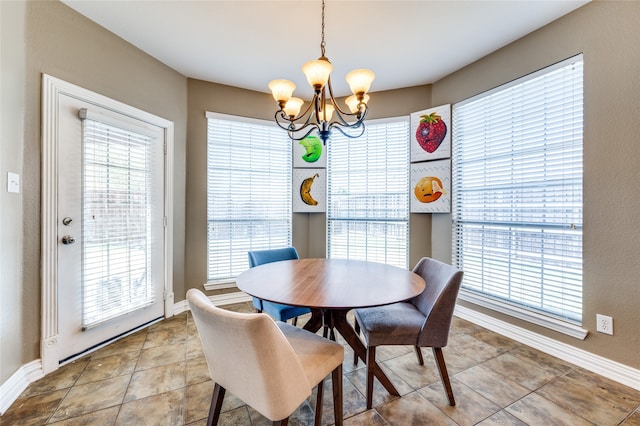 dining room featuring a wealth of natural light and a chandelier