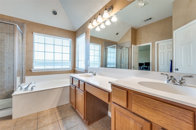 bathroom with vanity, lofted ceiling, tile patterned floors, and separate shower and tub