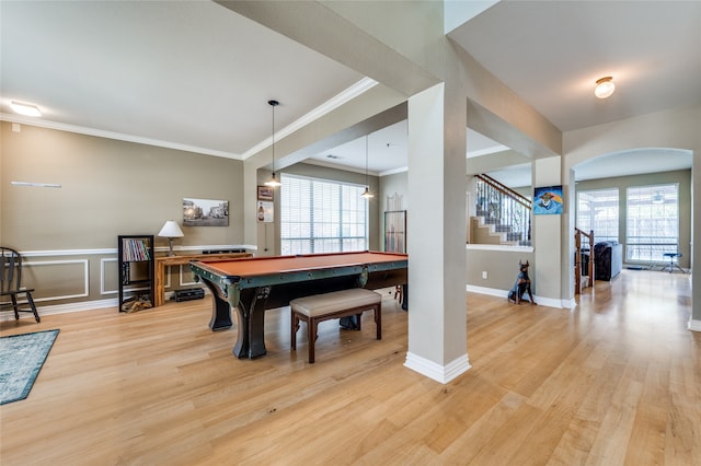 game room featuring light wood-type flooring, a wealth of natural light, pool table, and ornamental molding